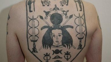 The tattoos on Hunnisett's back